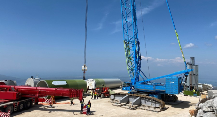 wind experts monitoring wind farm construction